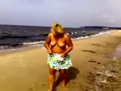 Going topless on the beach is a must for my passionate wife.